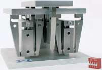 Long-travel (10 mm) multi-dimensional, Roberts-linkage flexure system prevents parallelogram errors in XYZ positioning applications.